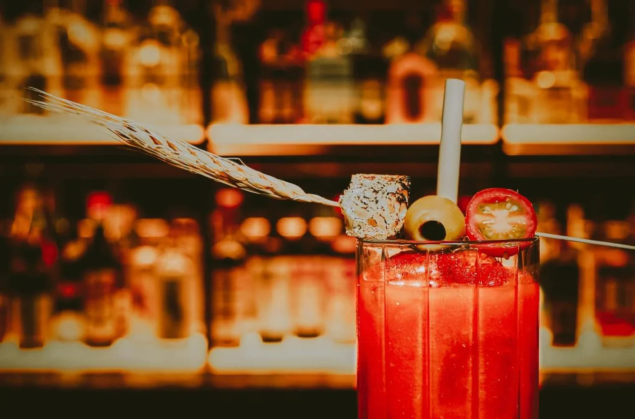 A cocktail with a straw served at The Mayfair Townhouse in London
